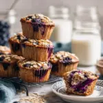 Freshly baked easy blueberry muffins on a cooling rack.