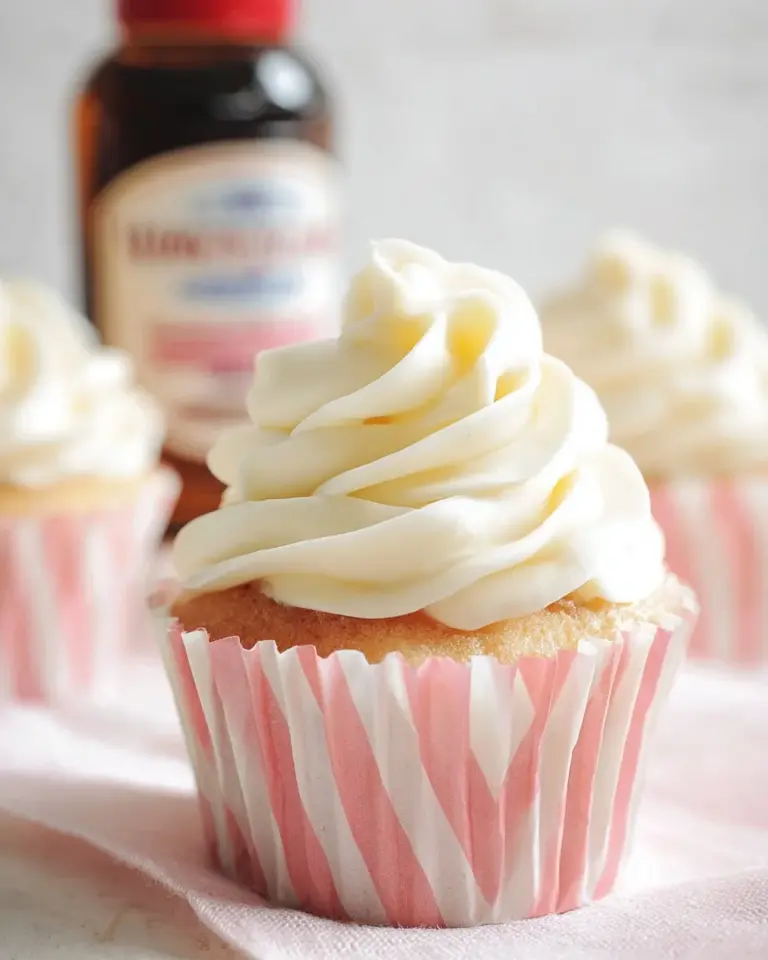 Raspberry Vanilla Cream Cheese Cupcakes with fresh raspberries and frosting